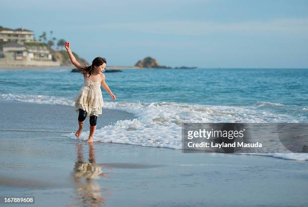 chasing wind and water - with little girl - laguna beach california stock pictures, royalty-free photos & images