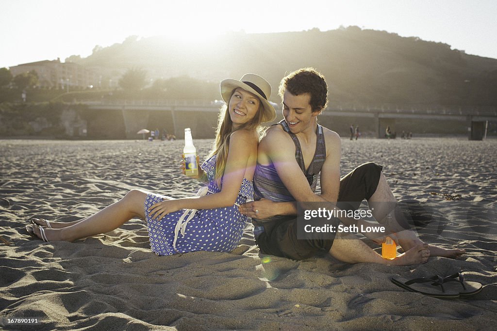 Young couple on beach at sunset