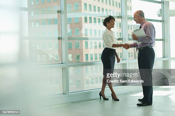 business people shaking hands in office - handshake stock pictures, royalty-free photos & images