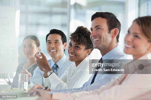 business people sitting in meeting - formal businesswear stock pictures, royalty-free photos & images