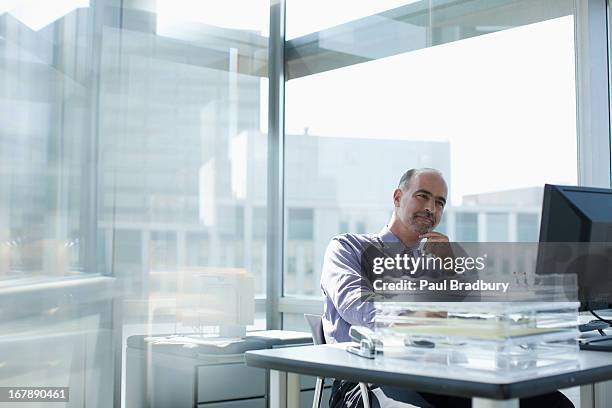 businessman working at desk - managing uncertainty stock pictures, royalty-free photos & images