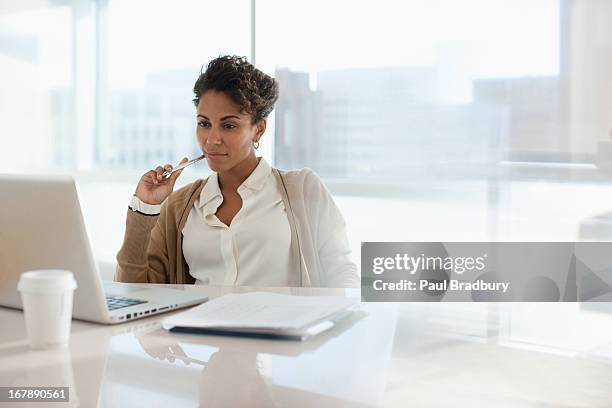 businesswoman using laptop in office - office one person stock pictures, royalty-free photos & images