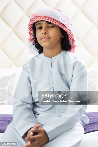 young middle eastern boy in traditional dress - ghoutra stock pictures, royalty-free photos & images