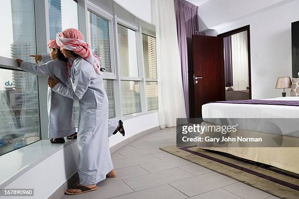 emirate children in hotel room - ghoutra stock pictures, royalty-free photos & images