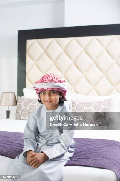 young middle eastern boy in traditional dress - ghoutra stock pictures, royalty-free photos & images