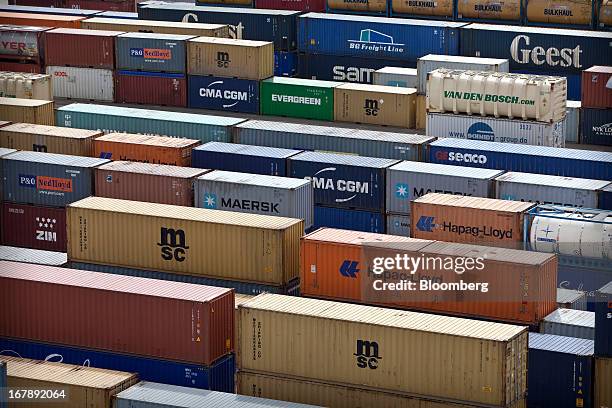 Shipping containers from P&O, Evergreen, MSC, Hapag-Lloyd, Maersk, Geest and BG Freight Line, and others are seen stacked on the dockside at...