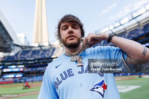 Producer Murda Beatz throws out the first pitch at the MLB game between the Toronto Blue Jays and the Washington Nationals at Rogers Centre on August...