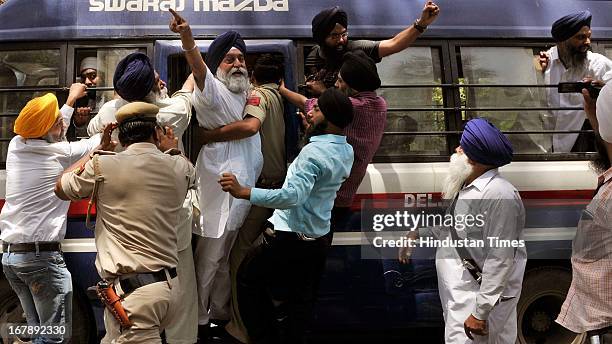 Sikh protesters being taken to police station from outside Congress Party President Sonia Gandhi's residence during a protest against the acquittal...