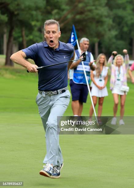 Anton du Beke of England the BBC Strictly Come Dancing dancer and judge celebrates holing a birdie putt during the pro-am prior to the BMW PGA...