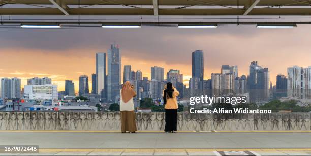 cityscape in southeast asian big city - indonesia electricity development in jakarta stock pictures, royalty-free photos & images