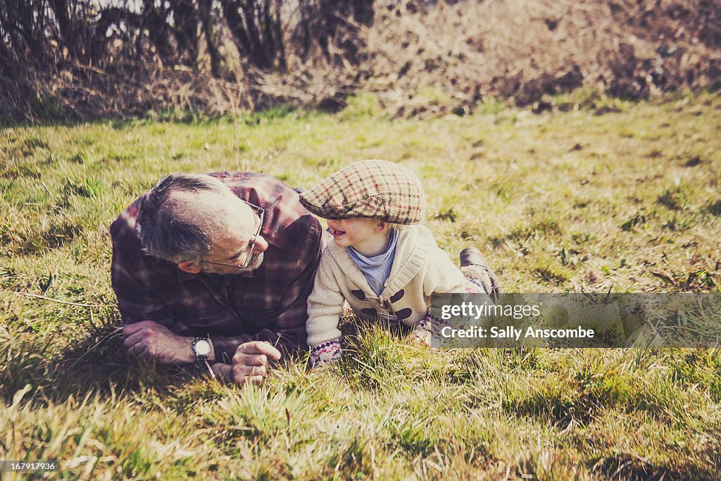 Little toddler girl with her grandpa