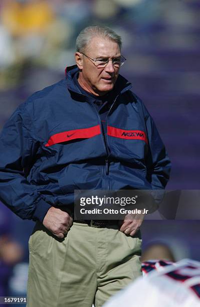 Coach John Mackovic of the Arizona Wildcats focuses on play from the sideline during the NCAA football game against the Washington Huskies at Husky...