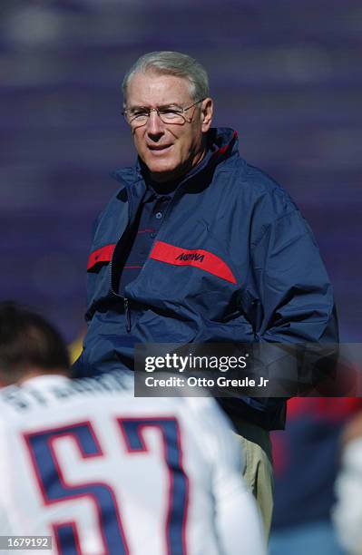 Coach John Mackovic of the Arizona Wildcats talks to his defense on the sideline during the NCAA football game against the Washington Huskies at...
