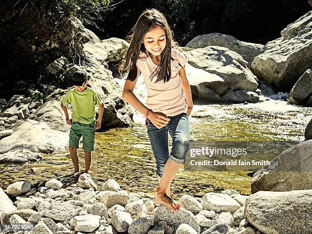 testing the water - indian family vacation stock pictures, royalty-free photos & images