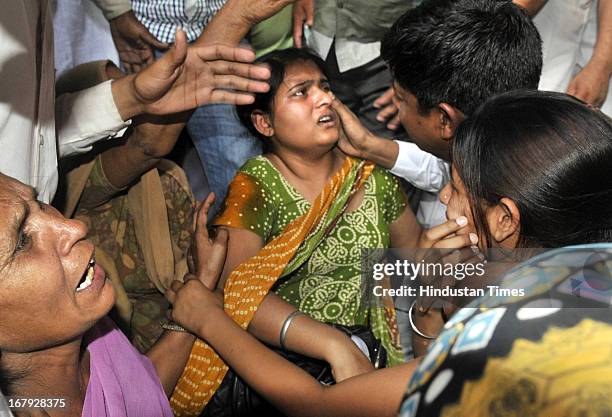 Sukhpreet Kaur, wife and daughters Swapandeep and Poonam of Sarabjit Singh, an Indian prisoner in Pakistan who died in Pakistan hospital after being...