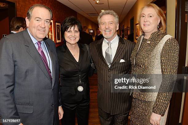 Former Arkansas Governor Mike Huckabee, Janis Ross, country musician Larry Gatlin, and Janet Huckabee attend the funeral service for George Jones at...