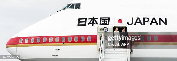 Japanese Crown Prince Naruhito and Princess Masako wave before departing from Schiphol Airport, near Amsterdam, on May 2, 2013. The Japanese royals...