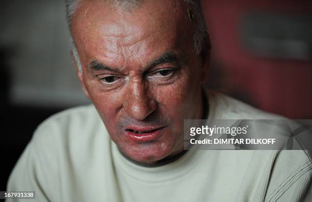 Diana SIMEONOVA == Dimitar Dimitrov speaks during an AFP interview in his appartment in Sofia on April 24, 2013. "It was my protest, not a suicide,"...