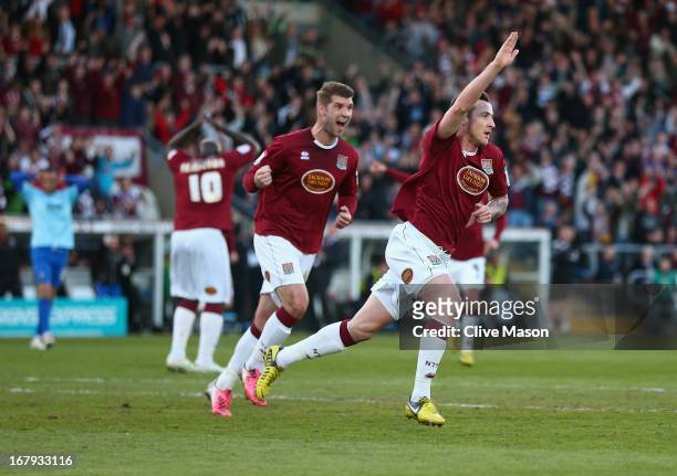 Roy O'Donovan of Northampton Town celebrates scoring during the npower League Two Play Off Semi Final First Leg match between Northampton Town and...