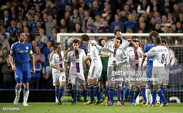 Basel's players celebrate after Egyptian midfielder Mohamed Salah scored a goal in the last minute of the first half against Chelsea during the...