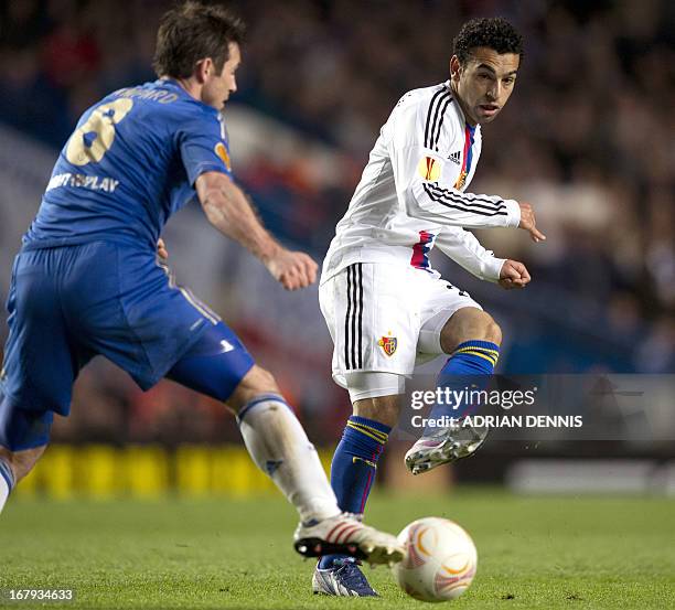 Basel's Egyptian midfielder Mohamed Salah plays a pass past Chelsea's English midfielder Frank Lampard during the Europa League semi-final second leg...