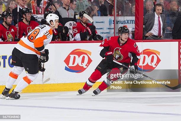 Oliver Lauridsen of the Philadelphia Flyers defends against Colin Greening of the Ottawa Senators during an NHL game, at Scotiabank Place, on April...