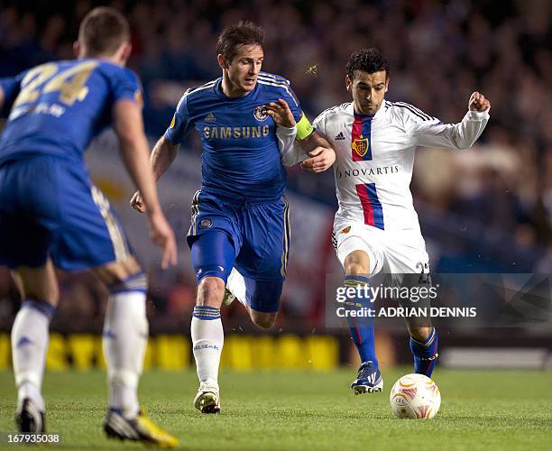 Basel's Egyptian midfielder Mohamed Salah vies for the ball with Chelsea's English midfielder Frank Lampard during the Europa League semi-final...