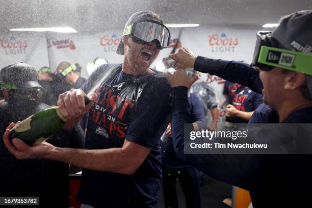 The Atlanta Braves celebrate after defeating the Philadelphia Phillies to clinch the NL East at Citizens Bank Park on September 13, 2023 in...