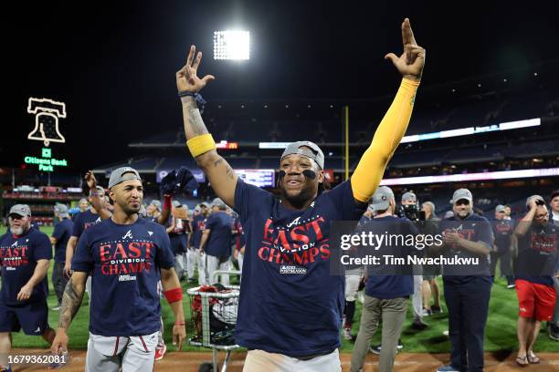 Ronald Acuna Jr. #13 of the Atlanta Braves reacts after defeating the Philadelphia Phillies to clinch the NL East at Citizens Bank Park on September...