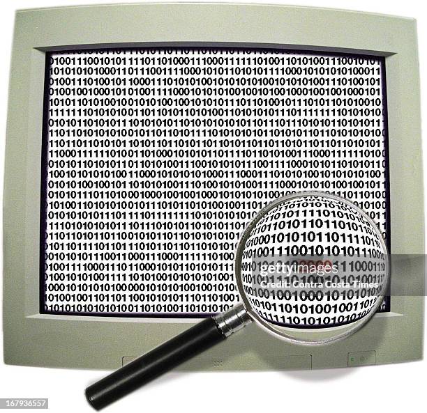 59p x 57p Jon Manlove color illustration of a computer monitor with magnifying glass illuminating the year 2000 among a screen of 1s and 0s.