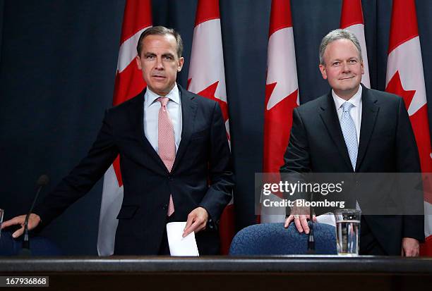 Mark Carney, outgoing governor of the Bank of Canada, left, and Stephen Poloz, incoming governor of the Bank of Canada, arrive for a press conference...