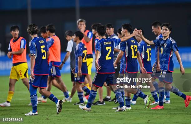 Players of Japan celebrate after winning the 19th Asian Games Hangzhou match betweenJapan and Qatar Xiaoshan Sports Centre Stadium in Hangzhou,...