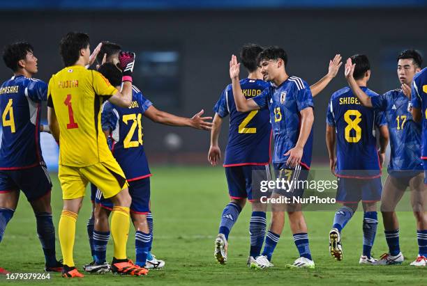 Players of Japan celebrate after winning the 19th Asian Games Hangzhou match betweenJapan and Qatar Xiaoshan Sports Centre Stadium in Hangzhou,...