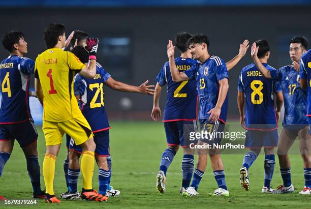 Players of Japan celebrate after winning the 19th Asian Games Hangzhou match betweenJapan and Qatar Xiaoshan Sports Centre Stadium in Hangzhou,...