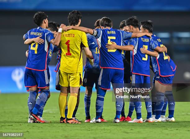 Japan team players gather during the 19th Asian Games Hangzhou match betweenJapan and Qatar Xiaoshan Sports Centre Stadium in Hangzhou, China's...