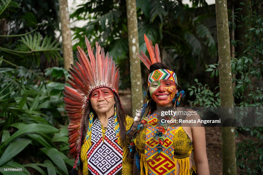 Portrait of Indian mother and daughter in the forest