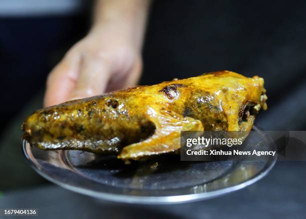 This photo shows a roast pigeon sold in a shop at the Khan el-Khalili in Cairo, Egypt, July 28, 2023. Chongqing, a city by the Yangtze River, is...