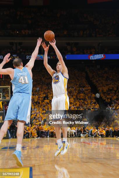David Lee of the Golden State Warriors shoots against Kosta Koufos of the Denver Nuggets in Game Six of the Western Conference Quarterfinals during...