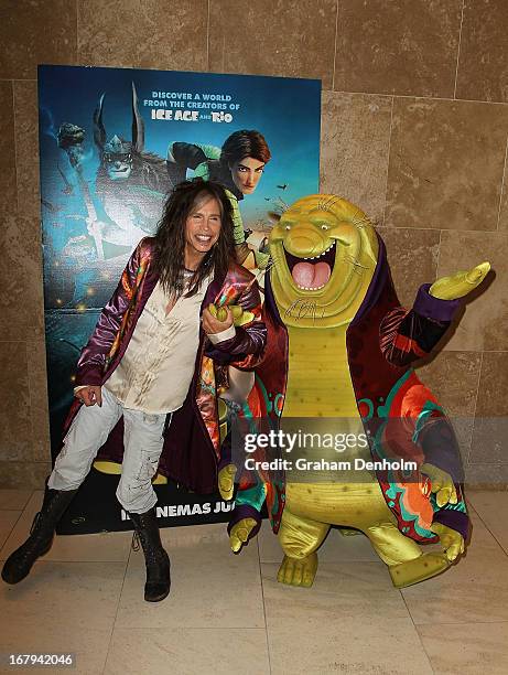 Aerosmith singer Steven Tyler poses with character Nim Galuu during a photo call at Crown Towers on May 3, 2013 in Melbourne, Australia.