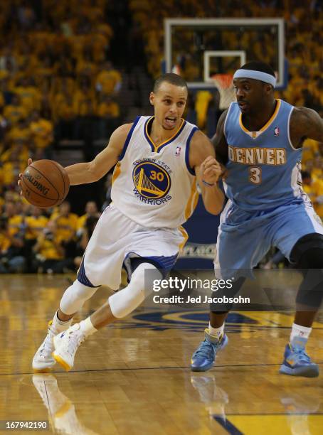 Ty Lawson of the Denver Nuggets defends Stephen Curry of the Golden State Warriors during Game Six of the Western Conference Quarterfinals of the...