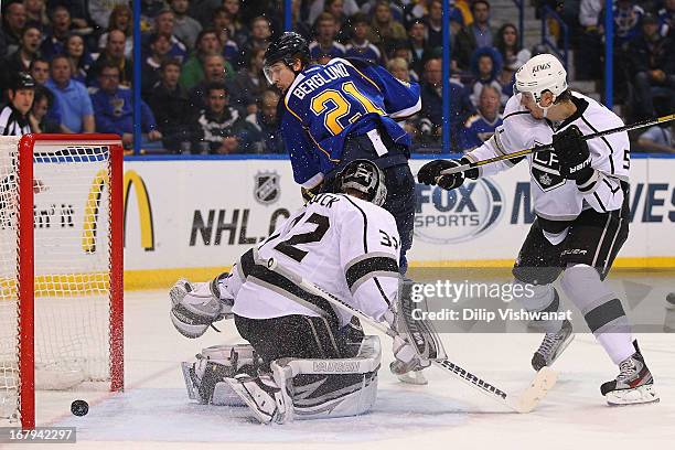 Patrik Berglund of the St. Louis Blues scores the game-tying goal against Jonathan Quick and Keaton Ellerby of the Los Angeles Kings in Game Two of...