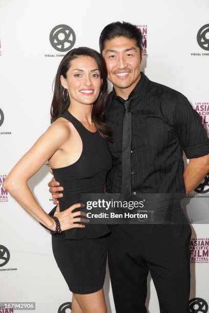 Mirelly Taylor and actor Brian Tee attends the 2013 LA Asian Pacific Film Festival - opening night premiere of "Linsanity" at the Directors Guild Of...