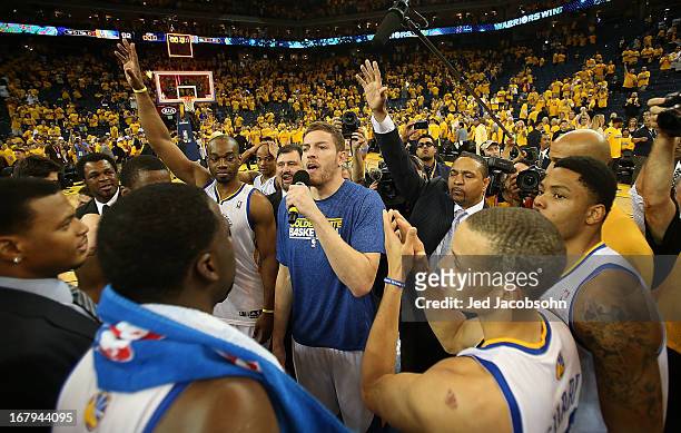 David Lee of the Golden State Warriors of the Golden State Warriors celebrates with his teammates defeating the Denver Nuggets during Game Six of the...