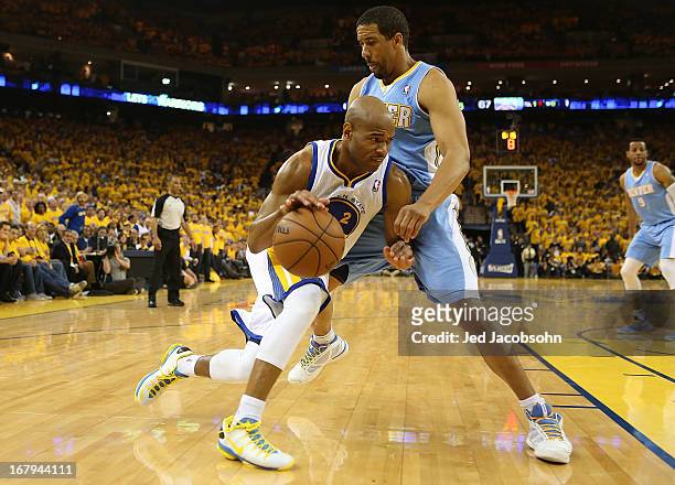 Jarrett Jack of the Golden State Warriors drives against Andre Miller of the Denver Nuggets during Game Six of the Western Conference Quarterfinals...