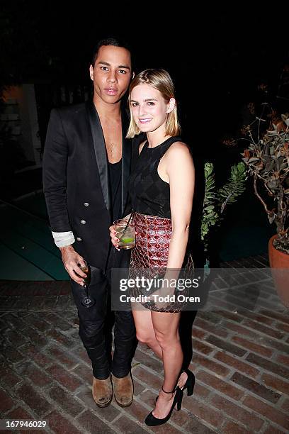 Designer Olivier Rousteing and Nathalie Love pose at the Balmain LA Dinner at Chateau Marmont on May 2, 2013 in Los Angeles, California.