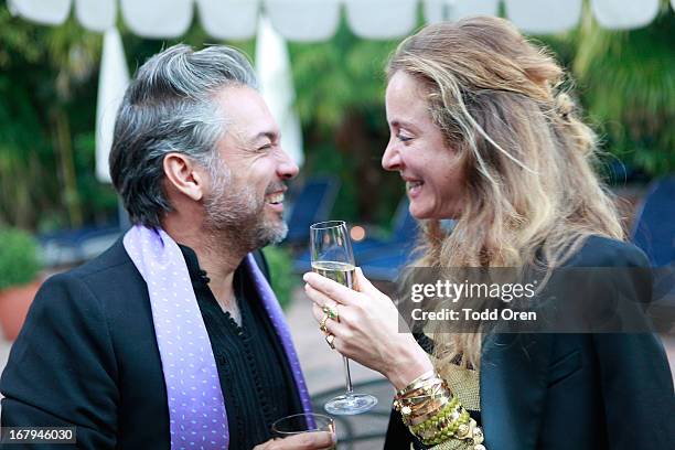 Carlos Mota and Aurelie Bidermann talk at the Balmain LA Dinner at Chateau Marmont on May 2, 2013 in Los Angeles, California.