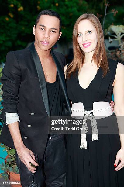 Designer Olivier Rousteing and Liz Goldwyn pose at the Balmain LA Dinner at Chateau Marmont on May 2, 2013 in Los Angeles, California.