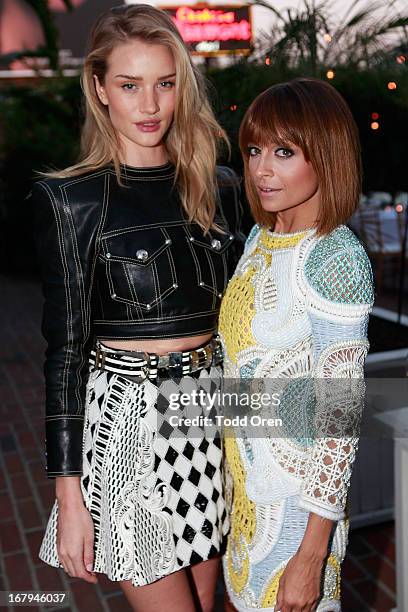 Actress/model Rosie Huntington-Whiteley and Nicole Richie attend the Balmain LA Dinner at Chateau Marmont on May 2, 2013 in Los Angeles, California.
