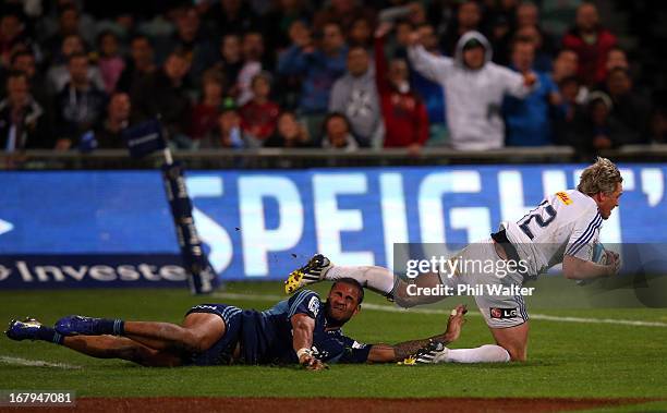 Jean De Villiers of the Stormers scores a try in the tackle of Frank Halai of the Blues during the round 12 Super Rugby match between the Blues and...
