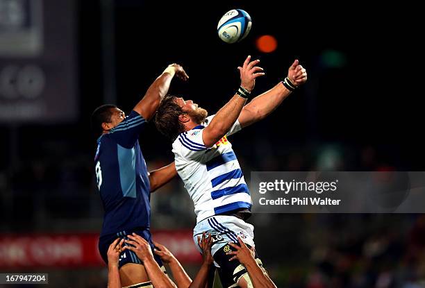 Andries Bekker of the Stormers takes the ball in the lineout over Peter Saili of the Blues during the round 12 Super Rugby match between the Blues...